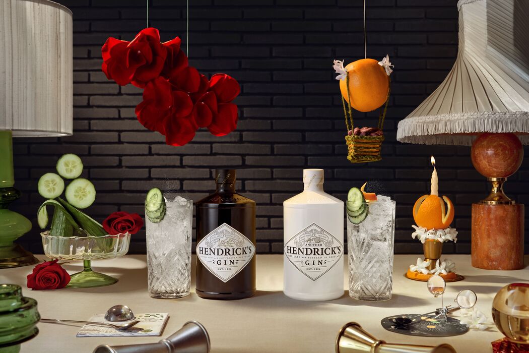 Hendrick's Original and Hendrick's Another bottles mirrored with highball serves